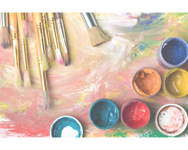 Artist color pallet with paints and brushes